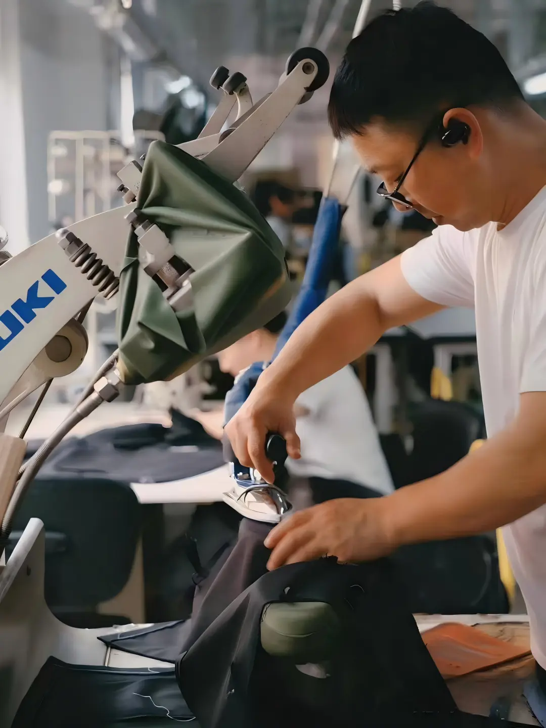 Apparel technician carrying out a garment production step in the factory