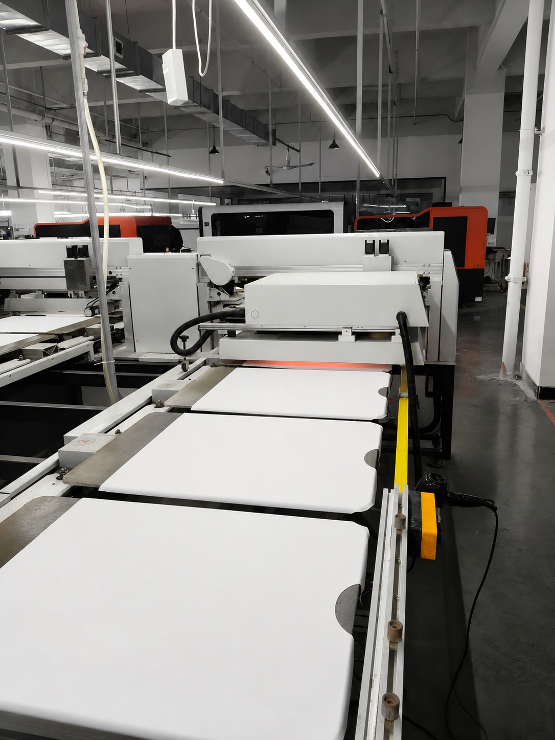 Custom apparel printing equipment in a production facility