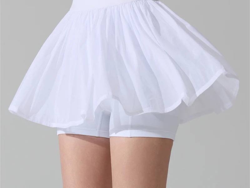 White pickleball skort with visible built-in shorts
